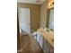 Bathroom with double sinks, linoleum flooring, and neutral wall color at 8125 Weeping Fig Ln, Charlotte, NC 28215