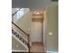Inviting entryway with staircase, neutral walls, white trim, and tile flooring offering a clean transition at 8125 Weeping Fig Ln, Charlotte, NC 28215