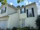 Charming home featuring a two-story design, light siding, and black shutters, creating a welcoming curb appeal at 8125 Weeping Fig Ln, Charlotte, NC 28215