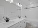 Bright bathroom featuring double vanity, a large mirror, and a shower-tub combo with sleek, matte black fixtures at 8303 Adrian Ct, Charlotte, NC 28270