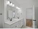 Bathroom with a double vanity and framed mirrors at 8303 Adrian Ct, Charlotte, NC 28270