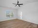 Spacious bedroom with ceiling fan and natural light, features modern design at 8303 Adrian Ct, Charlotte, NC 28270