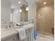 Well-lit bathroom featuring a glass shower and a vanity with chrome fixtures at 8500 Longview Club Dr, Waxhaw, NC 28173