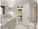 Elegant bathroom featuring dual vanities, stylish wallpaper, and modern fixtures at 8500 Longview Club Dr, Waxhaw, NC 28173