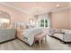 Bedroom with a chandelier, large bed, and a sitting area with a sofa at 8500 Longview Club Dr, Waxhaw, NC 28173