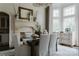Elegant dining room with fireplace, chandelier, and large windows for ample natural light at 8500 Longview Club Dr, Waxhaw, NC 28173