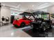 Spacious garage with car lift, epoxy floors, and parking for golf cart at 8500 Longview Club Dr, Waxhaw, NC 28173