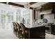 Elegant kitchen with an oversized island, high-end appliances, and large windows, creating a perfect cooking space at 8500 Longview Club Dr, Waxhaw, NC 28173