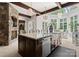 Gourmet kitchen features a stone fireplace, marble counters, and light-filled breakfast nook at 8500 Longview Club Dr, Waxhaw, NC 28173