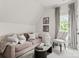 Cozy living room with neutral tones, couch, accent chair and window at 8500 Longview Club Dr, Waxhaw, NC 28173