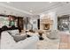 Inviting living room features a fireplace, wet bar and opens to a home office at 8500 Longview Club Dr, Waxhaw, NC 28173