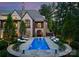 A private swimming pool surrounded by lounge seating and manicured landscaping offering a serene outdoor retreat at 8500 Longview Club Dr, Waxhaw, NC 28173