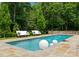 Inviting swimming pool with decorative fountains, comfortable lounge seating and lush greenery for a relaxing outdoor experience at 8500 Longview Club Dr, Waxhaw, NC 28173