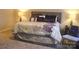 Inviting bedroom featuring a comfortable bed, plush carpet, and coordinated decor accents at 858 Oak Manor Se Dr, Concord, NC 28025