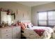 Bright bedroom features pink accents, a full bed, and plenty of storage at 858 Oak Manor Se Dr, Concord, NC 28025