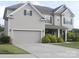 Attractive two-story home featuring a spacious driveway and manicured landscaping at 858 Oak Manor Se Dr, Concord, NC 28025