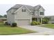 Well-maintained home with an attached garage and a neatly landscaped front yard at 858 Oak Manor Se Dr, Concord, NC 28025