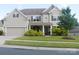 Charming two-story home with a well-maintained lawn and inviting front porch at 858 Oak Manor Se Dr, Concord, NC 28025