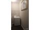 Neat laundry room with modern washer and dryer, wire rack, and an elegant piece of art at 858 Oak Manor Se Dr, Concord, NC 28025