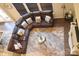 Aerial shot of a living room featuring a leather couch, fireplace, and shag carpet at 858 Oak Manor Se Dr, Concord, NC 28025