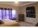 Spacious main bedroom with a modern electric fireplace and TV console for added relaxation at 858 Oak Manor Se Dr, Concord, NC 28025