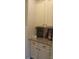 Pantry featuring granite counters and white cabinets for ample storage at 858 Oak Manor Se Dr, Concord, NC 28025