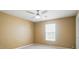 Bedroom featuring a ceiling fan, carpet, and a window at 8604 Rockmoor Ridge Rd, Charlotte, NC 28215