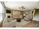 Staged living room with neutral furniture, fireplace, and modern decor at 8604 Rockmoor Ridge Rd, Charlotte, NC 28215