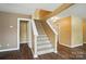 Carpeted staircase with white railing and trim leads to upper level at 8604 Rockmoor Ridge Rd, Charlotte, NC 28215