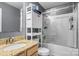 Bathroom features a granite vanity top, storage unit, and glass-door shower at 9236 Clifton Meadow Dr, Matthews, NC 28105