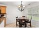 Cozy dining area with stylish light fixture next to a kitchen space at 9236 Clifton Meadow Dr, Matthews, NC 28105