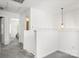 Hallway boasts neutral paint, carpet flooring, and an open doorway into a bedroom at 9236 Clifton Meadow Dr, Matthews, NC 28105