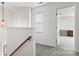 Upstairs hallway featuring neutral paint, carpet flooring, and an open doorway to another room at 9236 Clifton Meadow Dr, Matthews, NC 28105