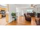 Open-concept living area features hardwood floors and fireplace, flowing to kitchen area at 9236 Clifton Meadow Dr, Matthews, NC 28105