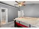 Well-lit main bedroom with a vaulted ceiling and attached bathroom featuring neutral paint at 9236 Clifton Meadow Dr, Matthews, NC 28105