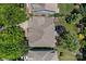 Aerial view of a well-maintained home with a spacious backyard surrounded by lush trees at 9412 Rosalyn Glen Rd, Cornelius, NC 28031