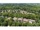 An aerial view of a beautiful neighborhood, showcasing tree-lined streets, well-maintained homes, and lush green spaces at 9412 Rosalyn Glen Rd, Cornelius, NC 28031