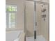 A well-appointed bathroom features a glass-enclosed shower and a relaxing soaking tub at 9412 Rosalyn Glen Rd, Cornelius, NC 28031