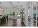 Inviting entryway with hardwood floors, an open door and a clear view to the outside at 9412 Rosalyn Glen Rd, Cornelius, NC 28031
