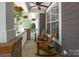 Inviting front porch featuring comfortable seating and hanging floral baskets, creating a relaxing outdoor space at 9412 Rosalyn Glen Rd, Cornelius, NC 28031