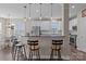 Modern kitchen featuring stainless steel appliances, white cabinetry, pendant lighting, and breakfast bar at 9412 Rosalyn Glen Rd, Cornelius, NC 28031