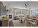 Cozy living room with a fireplace, large windows, plush seating, and stylish decor at 9412 Rosalyn Glen Rd, Cornelius, NC 28031