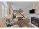 A spacious main bedroom boasts hardwood floors, seating area and a cozy fireplace at 9412 Rosalyn Glen Rd, Cornelius, NC 28031