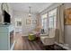 A cozy sitting room features neutral decor, two armchairs and a fireplace with built-ins at 9412 Rosalyn Glen Rd, Cornelius, NC 28031