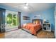 Bright bedroom with wood floors, a comfortable bed, and a large window with outside scenic view at 10043 Tepa Pl, Tega Cay, SC 29708