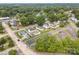 Drone image of a quaint, tree-filled residential area, highlighting the surrounding community at 1008 Valley St, Kannapolis, NC 28081