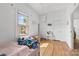 Inviting bedroom with ample natural light, featuring charming decor and wood flooring at 1008 Valley St, Kannapolis, NC 28081