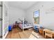 Cozy bedroom with wood floors, natural light from the window, and a charming, whimsical style at 1008 Valley St, Kannapolis, NC 28081