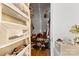 Organized walk-in closet with built-in shelves and shoe racks, offering ample storage space at 1008 Valley St, Kannapolis, NC 28081
