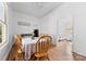 Charming dining room with wood floors, a table for six, and a view to the bedrooms at 1008 Valley St, Kannapolis, NC 28081